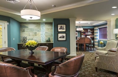 Interior common area with seating and bookshelves