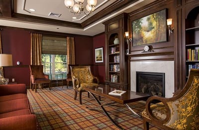 Cozy and elegant lounge area with seating and fireplace