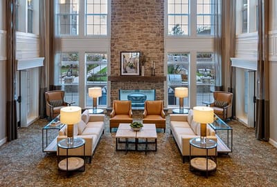 Interior lounge area with modern furnishings and large windows