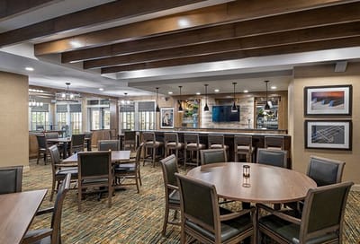 Common area with seating in a well-lit lounge