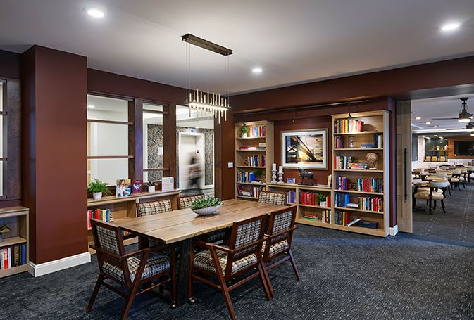 Cozy common area with bookshelves and seating