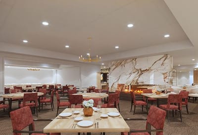 Elegant dining room with tables set for a meal