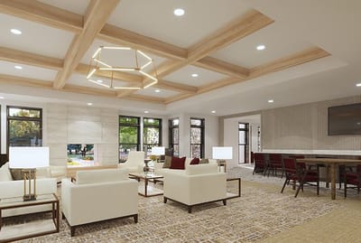 Bright, modern common area with seating and a dining space