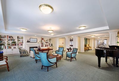 Bright common area with seating and bookshelves