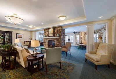 Bright common area with comfortable seating and fireplace