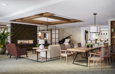 Bright and inviting common area with seating and dining