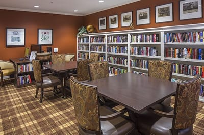 Cozy library area with bookshelves and seating