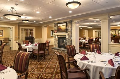 Elegant dining room with tables set for meals