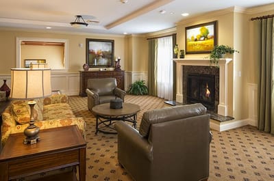 Cozy lounge area with seating and artwork