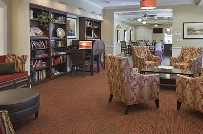 Common area with comfortable seating and bookshelves