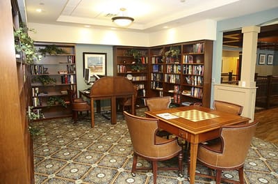 Cozy reading area with bookshelves and seating