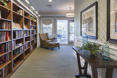 Cozy library corner with bookshelves and seating