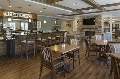 Bright and welcoming lounge area with seating and bar