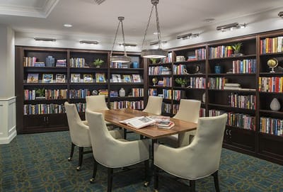 Cozy reading area with bookshelves and a table