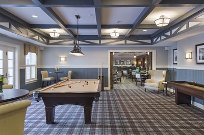 Common area with residents playing billiards