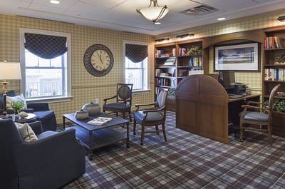 Cozy library area with bookshelves and seating