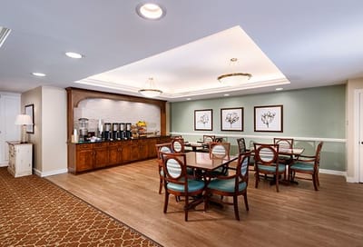 Bright dining area with tables and coffee station