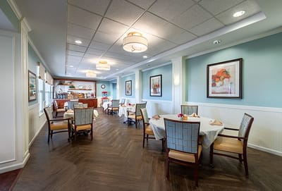 Dining area with tables and chairs set up elegantly