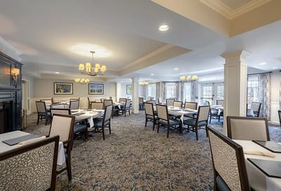 Dining room with tables and chairs set up for meals