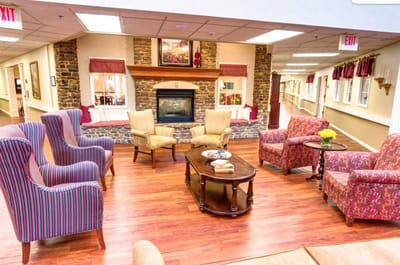 A cozy common area with seating and a fireplace