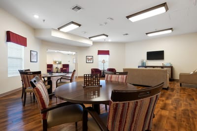 Bright common area with seating and tables