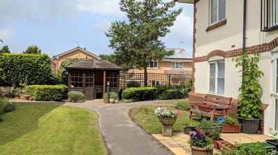 Garden area with seating and a garden shed