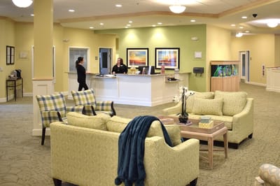 Cozy common area with staff at reception desk