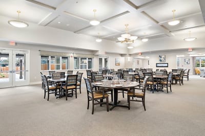 Dining room with multiple tables and chairs