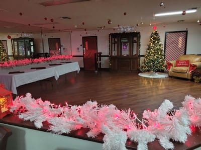 Interior decorated for a holiday event with a Christmas tree