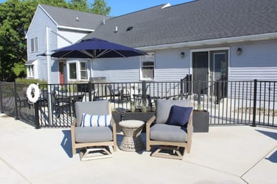 Outdoor seating area with chairs and an umbrella