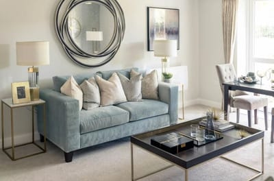 Stylish living room interior with a blue couch