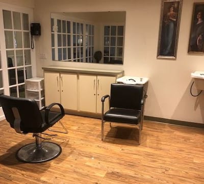Interior view of a hair salon with two chairs
