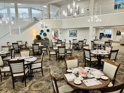 Bright dining room with tables set for residents