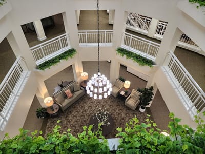 Interior view of a common area with seating and chandelier