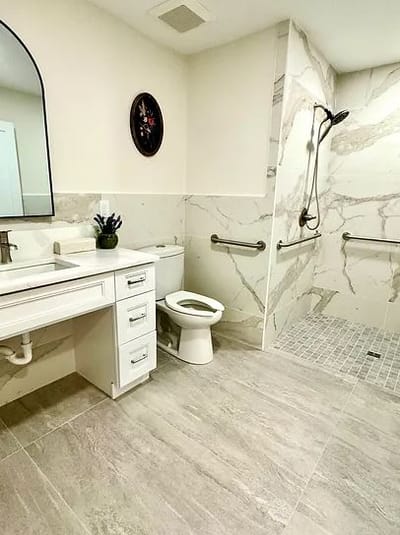 Modern bathroom with grab bars and shower