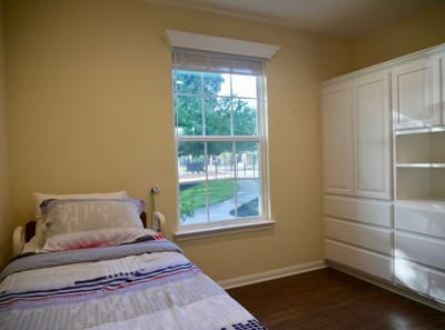 Cozy private resident room with a bed and window