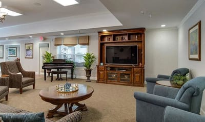 Comfortable common area with seating and piano