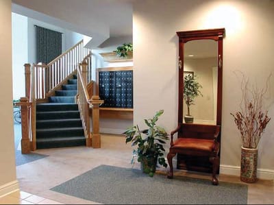 Interior view of a lobby with stairs and seating