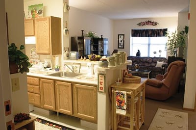 Interior view of a cozy living space with kitchen area