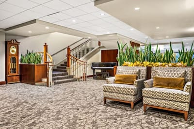 Bright interior common area with seating and plants