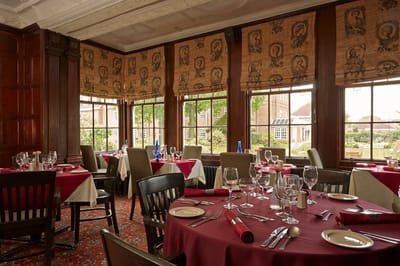 Elegant dining area with tables set for a meal