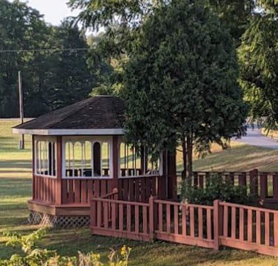 A gazebo in a landscaped outdoor area