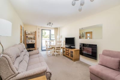 Cozy living room with sofas and dining area