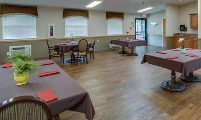 Dining area with tables set for residents