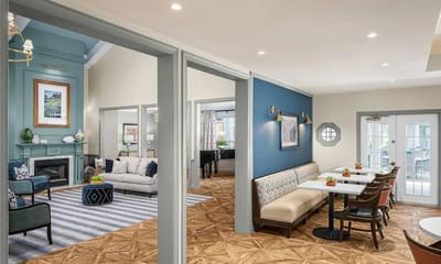 Bright common area with seating and tables