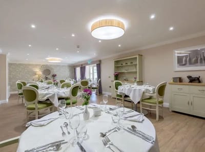 Dining area with elegantly set tables and decor