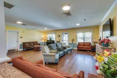 Common area with colorful seating and natural light