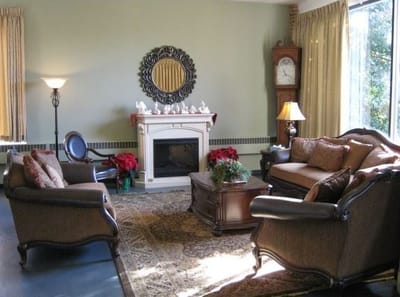 Cozy interior common area with a fireplace and seating