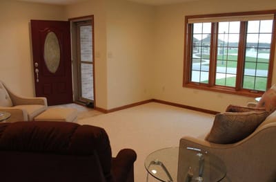 Bright common area with seating by large windows