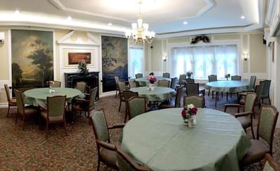 Bright dining room with tables set for meals